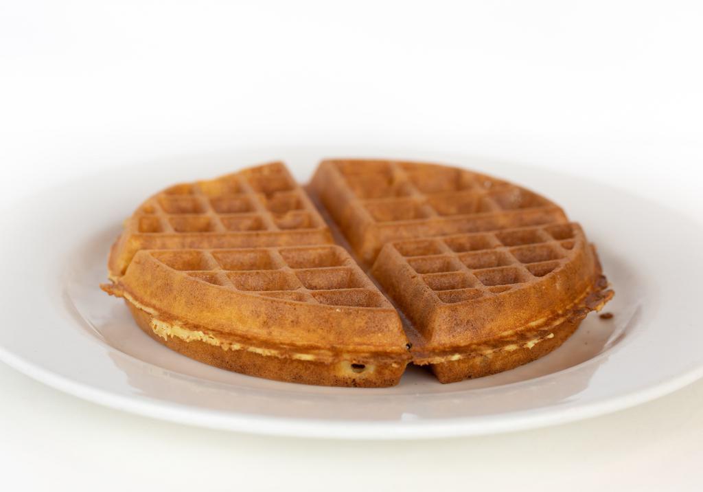 Plain Waffle · Golden brown waffle, served with whipped butter and hot maple syrup.