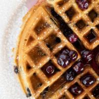 Blueberry Waffle · Baked with blueberries, sprinkled with powdered sugar. Served with a side of fresh blueberry...
