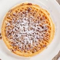 Pecan Waffle · Our golden brown waffle filled and topped with toasted pecans and lightly dusted with powder...