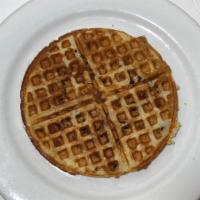 Bacon Waffle · Our golden brown waffle baked with real bits of bacon, served with whipped butter and hot ma...