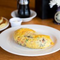 Fresh Veggies Omelette · Loaded with fresh sautéed broccoli, tomatoes, mushrooms and yellow cheddar cheese. (1,740 Ca...