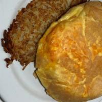 Cheese Omelet · Our fluffy omelet filled with aged cheddar cheese.