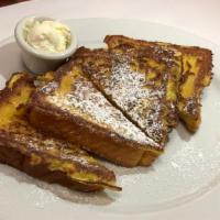 French Toast · Two slices of egg toast dipped in egg batter, dusted with powdered sugar.