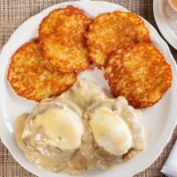 Eggs Michael · Grilled English Muffin topped with two of our special recipe sausage patties, two poached eg...