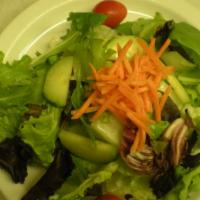 House Salad · Hearts of romaine topped with mixed greens, cucumbers, fresh tomatoes and carrots. Pepperonc...