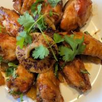 Pineapple Teriyaki Sauce Wings · Smothered with teriyaki sauce, soy sauce, pineapple chunks, and cilantro and served with blu...