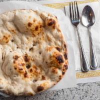 Buttered Naan · Oven baked flatbread.