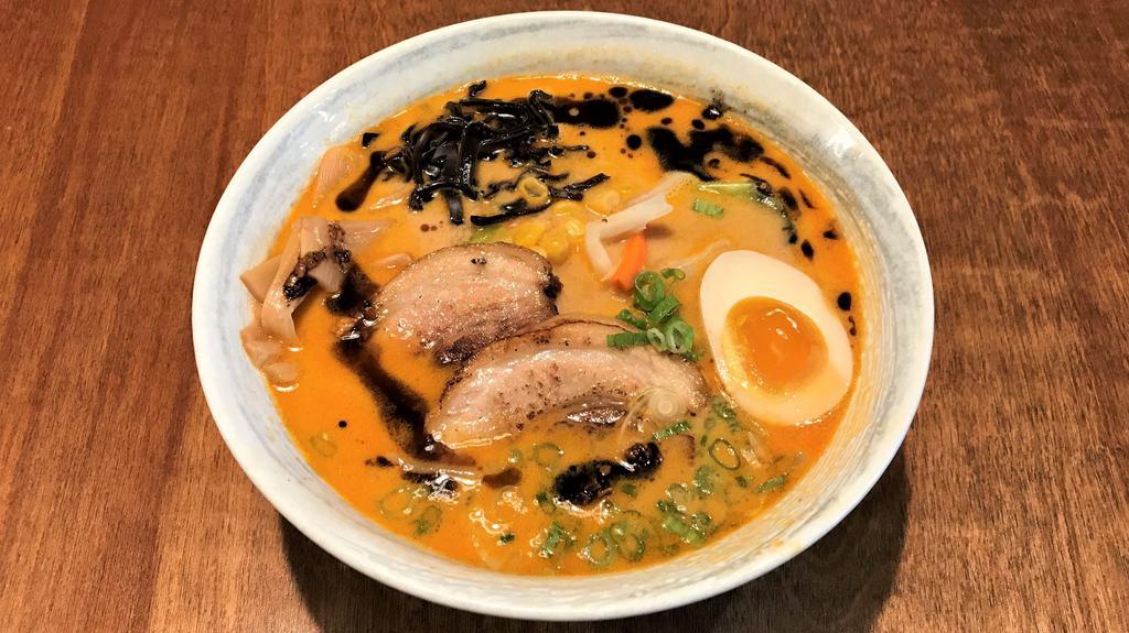 Miso Tonkotsu Ramen · Miso pork soup base: veggie mix(cabbage, carrot & bean sprouts), kikurage mushrooms, bamboo shoots, corn, green onion, half-boiled egg, black garlic oil & chashu pork.
(Veggie mix is already tossed together)