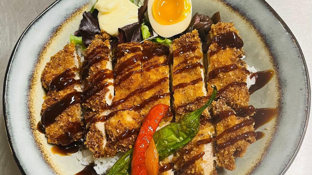 Chicken Katsu Don · Breaded Fried Chicken Katsu over Rice, salad, pickles,  mayo, brown sauce side, half-boiled egg, and peppers.