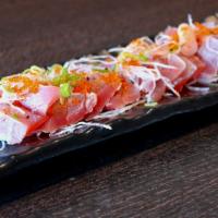 Tuna Tataki · Thinly sliced seared tuna in ponzu sauce.