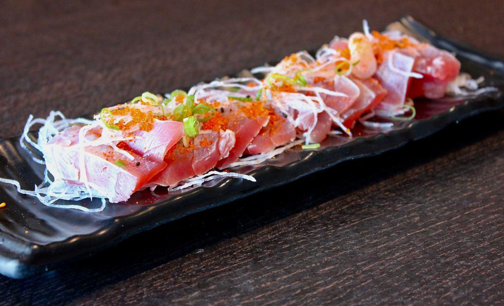 Tuna Tataki · Thinly sliced seared tuna in ponzu sauce.