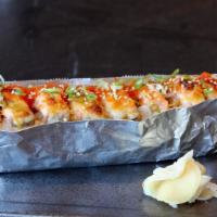 Lion King Roll · Crab , avocado topped salmon and spicy mayo baked with unagi sauce.