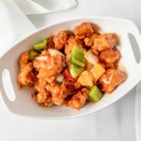 Sweet & Sour Pork · Crispy boneless pork tossed with bell peppers, pineapple, onions  in sweet and sour sauce.