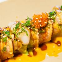 Lion King · Shrimp tempura, avocado, imitation crab inside. Salmon, scallop, vegetable outside. Baked wi...