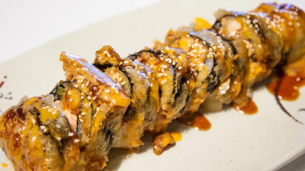 Mothra · Inside: spicy tuna. Deep fried outside: house sauce with tobiko onion, sesame.