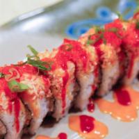 Prince Arima Roll · Inside: shrimp tempura, cook sake. Outside: spicy imitation crab, green onion, tobiko, and s...