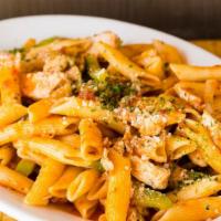 Penne Al Pollo · Chicken strips sauteed in white wine with diced tomatoes, bell peppers, and onions. Served w...