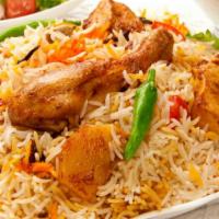 The Chicken Biryani · An exotic blend of basmati rice, fresh chicken and traditional spices and herbs.