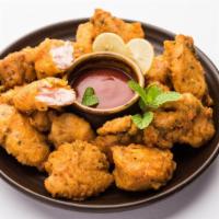 Chicken Pakora · Chicken freshly battered with chickpeas and Indian Spices. Comes with delicious tamarind sau...