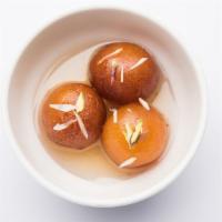 Gulab Jamun · Indian fried donuts soaked in rose scented syrup.