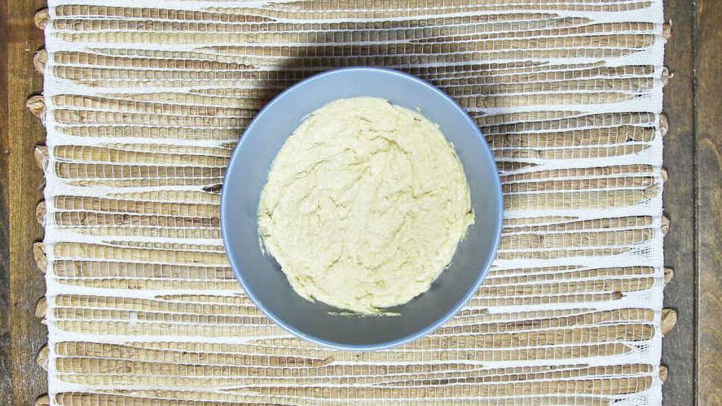 Hummus · Made from a blend of chickpeas, garlic, tahini, lemon juice, topped with olive oil.