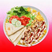 Spicy Chicken Shawarma Rice Platter · Tender chicken shawarma over rice and topped with spicy red sauce.  Served with  leafy green...