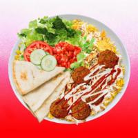 Spicy Falafel Rice Platter · Falafel over rice and topped with spicy red sauce.  Served with  leafy greens, white sauce, ...