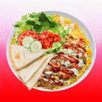Spicy Beef Shawarma Rice Platter · Juicy beef shawarma over rice and topped with spicy red sauce.  Served with  leafy greens, w...