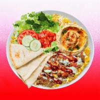 Spicy Beef Shawarma Hummus Platter · Juicy beef shawarma over hummus and topped with spicy red sauce.  Served with cucumber & tom...