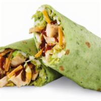 Smoky Bbq Chicken Wrap · Sliced chicken breast, Smoky BBQ Sauce, Cheddar, lettuce, tortilla strips and ranch in a spi...