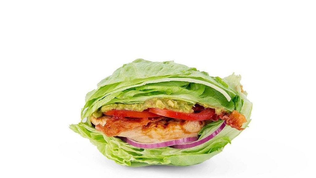 The Keto Green Queen · Grilled chicken, hardwood-smoked bacon, house-made guac, tomatoes and red onions in a lettuce wrap.