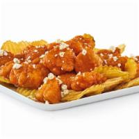 Boneless Wings · All-white meat boneless wings with your choice of sauce, served on a bed of Yukon kettle chi...