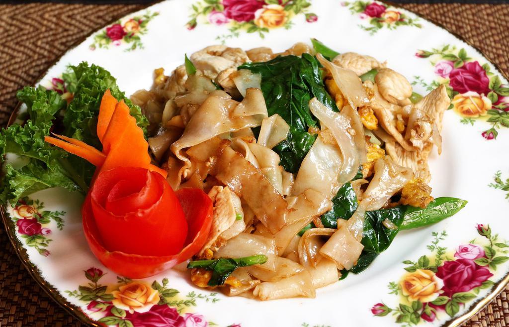Pad See Ew · Stir fried flat rice noodle and tofu and vegetables with egg, Chinese broccoli in sweet black soy sauce.