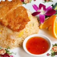 Fried Chicken over Fried Rice · Deep fried boneless chicken breast over fried rice with egg, white onion and tomato topped w...
