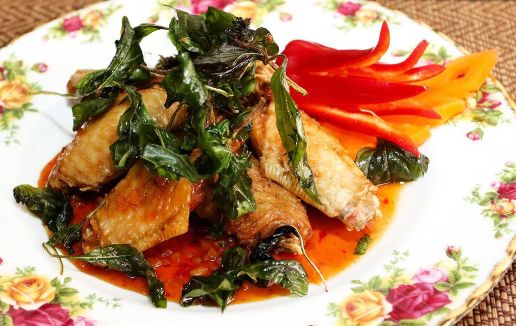 Angel Wings · Deep fried chicken wings topped with sweet and sour garlic sauce, crispy basil.