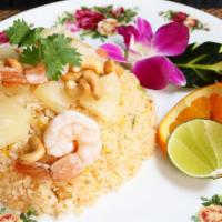 Pineapple Fried Rice · Thai style fried rice with chicken, shrimps, pineapple, white onion and cashew nut topped wi...