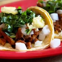 Al Pastor Tacos · 2 Tacos, Inspired by Mexico City Style, Marinated Pork in fresh juices and spices, onion, ci...