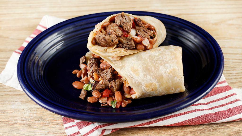 Carne Asada Burrito · Grilled steak with choice of beans, rice, pico de gallo and tortilla or try it naked with lettuce. Comes with a single serving of papalote salsa and a few chips.