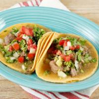 Chile Verde Taco · 2 Tacos. Tender chunks of pork cooked in a tangy, green tomatillo and serrano pepper sauce; ...