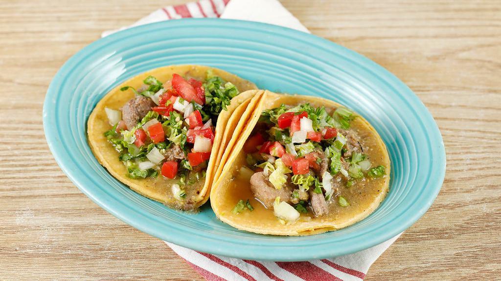 Chile Verde Taco · 2 Tacos. Tender chunks of pork cooked in a tangy, green tomatillo and serrano pepper sauce; served on a corn tortilla with pico de gallo and lettuce.