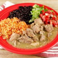 Chile Verde · Tender chunks of pork cooked slowly in a tangy tomatillo and serrano pepper sauce; served wi...