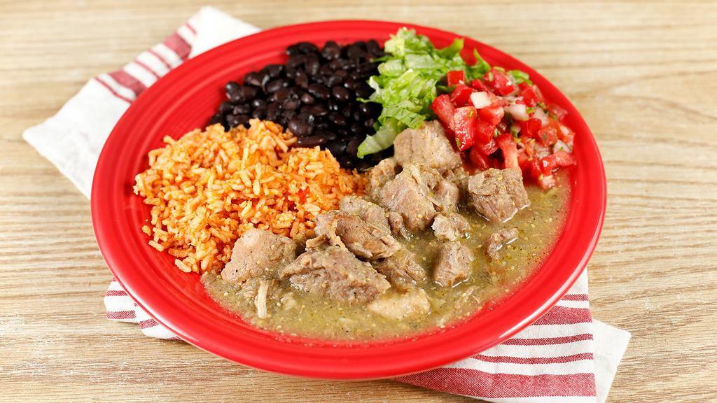 Chile Verde · Tender chunks of pork cooked slowly in a tangy tomatillo and serrano pepper sauce; served with rice, beans, tortillas