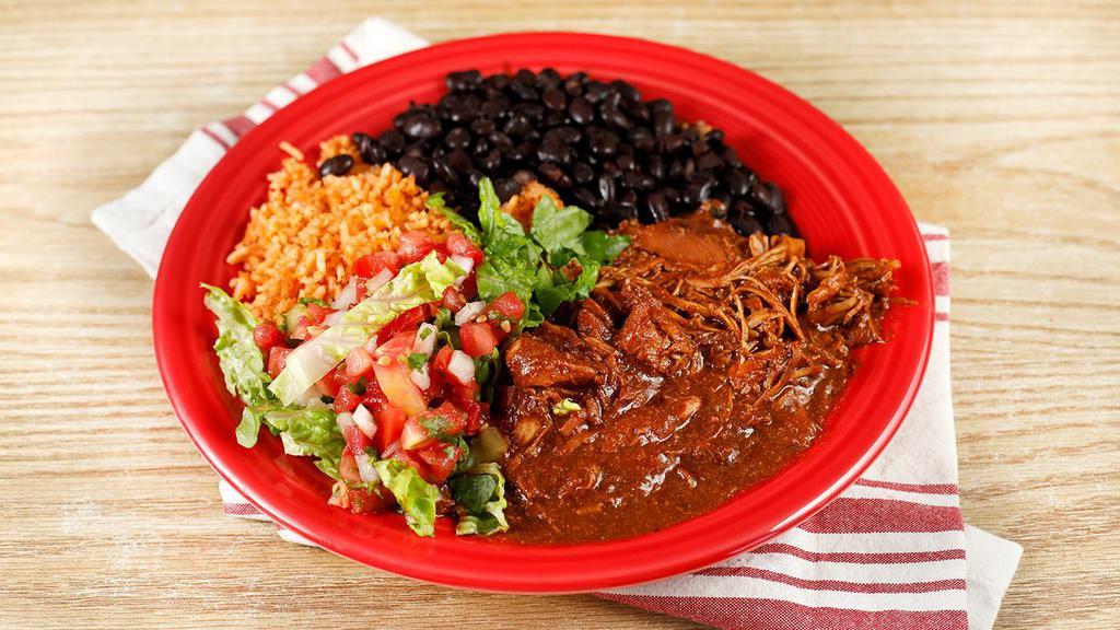 Mole con Pollo · Our unique vegan mole with chunks of fresh chicken breast; served with rice, beans, jicama salad, and tortillas