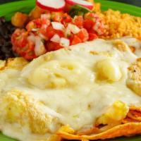 Chilaquiles · Tortilla strips cooked in our famous roasted salsa and cheese with or without eggs. Served w...