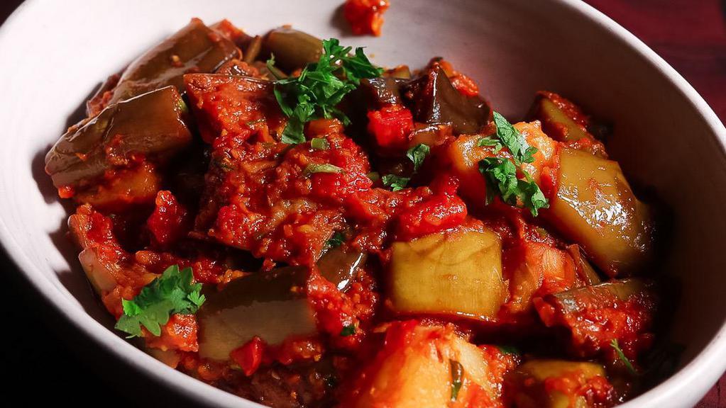 Eggplant Curry · Asian eggplant cooked with potato, ginger garlic paste, onion, and roasted spices with potatoes.