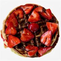 Strawberry Nutella Waffle · One Belgian waffle covered in Nutella and topped with strawberries. Served with syrup and wh...