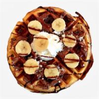 Nutella Banana Waffle · One Belgian waffle covered in Nutella and topped with fresh bananas. Served with syrup and w...