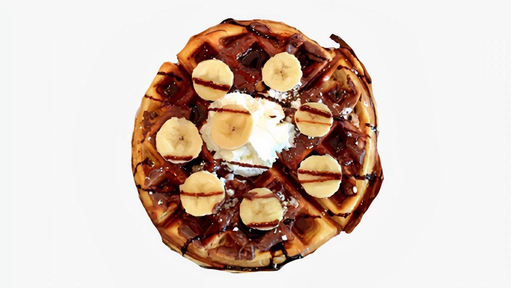 Nutella Banana Waffle · One Belgian waffle covered in Nutella and topped with fresh bananas. Served with syrup and whipped cream on the side.