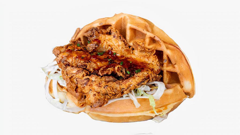 Fried Chicken & Waffle Sandwich · Crispy fried chicken with coleslaw, pickles, and mayo sandwiched between two Belgian waffles.
