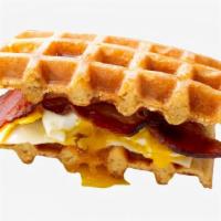 Bacon & Egg Waffle Sandwich · A fried egg with crispy bacon, cheddar cheese, and mayo sandwiched between two Belgian waffl...